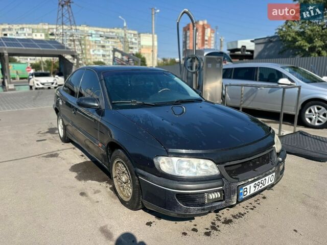 Черный Опель Омега, объемом двигателя 2.5 л и пробегом 350 тыс. км за 1674 $, фото 1 на Automoto.ua