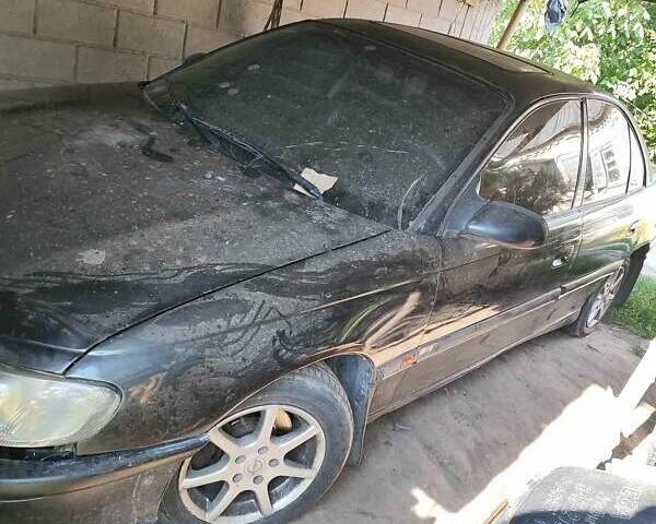 Черный Опель Омега, объемом двигателя 2.5 л и пробегом 999 тыс. км за 850 $, фото 1 на Automoto.ua