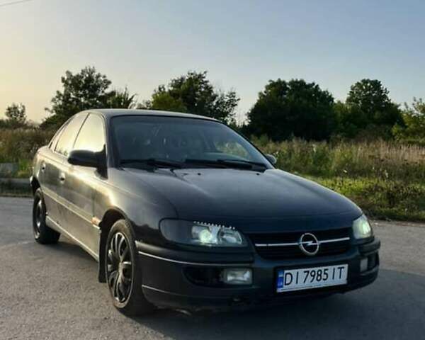 Черный Опель Омега, объемом двигателя 2.5 л и пробегом 400 тыс. км за 2100 $, фото 1 на Automoto.ua