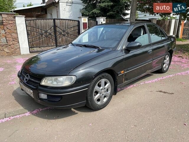 Черный Опель Омега, объемом двигателя 2.5 л и пробегом 440 тыс. км за 1500 $, фото 1 на Automoto.ua