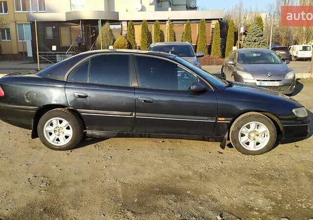 Чорний Опель Омега, об'ємом двигуна 2.5 л та пробігом 400 тис. км за 1650 $, фото 1 на Automoto.ua