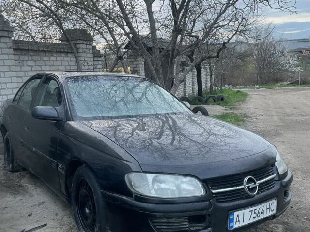 Черный Опель Омега, объемом двигателя 2.5 л и пробегом 250 тыс. км за 1200 $, фото 1 на Automoto.ua