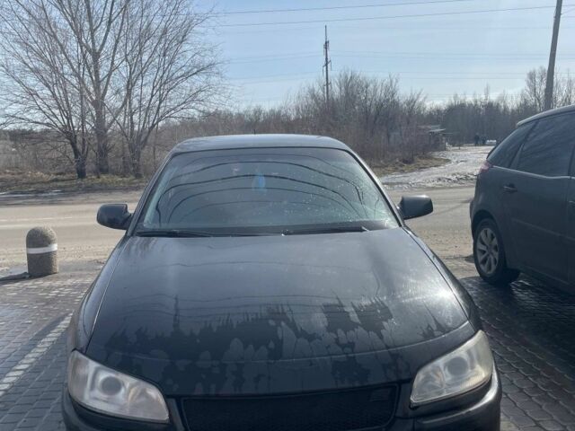 Черный Опель Омега, объемом двигателя 2.6 л и пробегом 270 тыс. км за 2000 $, фото 1 на Automoto.ua