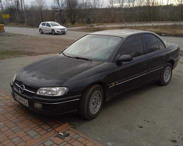 Черный Опель Омега, объемом двигателя 2.5 л и пробегом 328 тыс. км за 3000 $, фото 1 на Automoto.ua