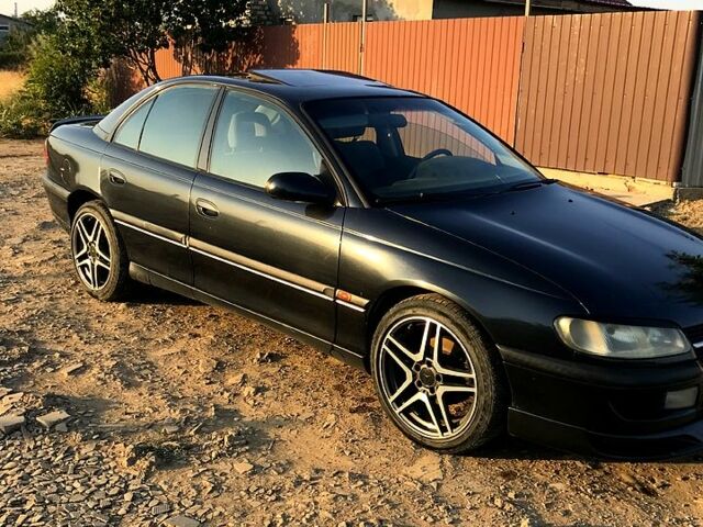 Черный Опель Омега, объемом двигателя 2 л и пробегом 450 тыс. км за 2700 $, фото 1 на Automoto.ua