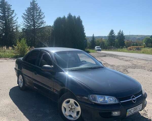 Черный Опель Омега, объемом двигателя 2 л и пробегом 250 тыс. км за 1300 $, фото 1 на Automoto.ua