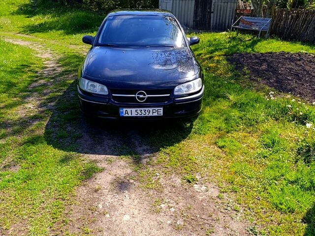 Чорний Опель Омега, об'ємом двигуна 2.5 л та пробігом 410 тис. км за 1950 $, фото 1 на Automoto.ua