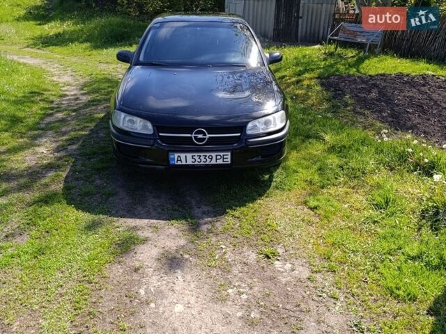 Чорний Опель Омега, об'ємом двигуна 2.5 л та пробігом 410 тис. км за 1950 $, фото 1 на Automoto.ua