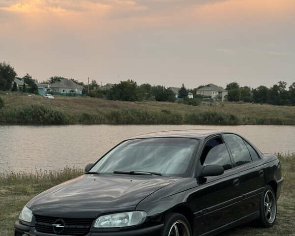 Чорний Опель Омега, об'ємом двигуна 2 л та пробігом 400 тис. км за 3000 $, фото 1 на Automoto.ua