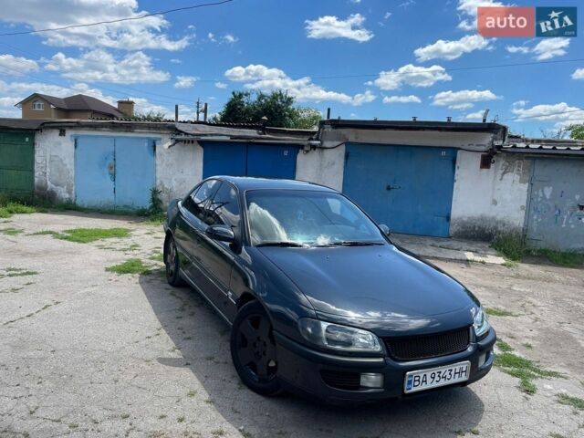 Черный Опель Омега, объемом двигателя 2.5 л и пробегом 370 тыс. км за 2500 $, фото 1 на Automoto.ua