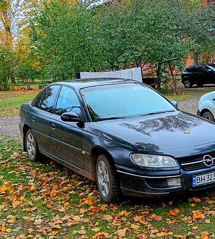 Чорний Опель Омега, об'ємом двигуна 2 л та пробігом 250 тис. км за 2000 $, фото 1 на Automoto.ua