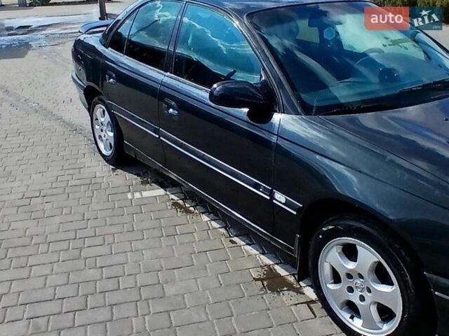 Черный Опель Омега, объемом двигателя 2.5 л и пробегом 350 тыс. км за 1300 $, фото 1 на Automoto.ua