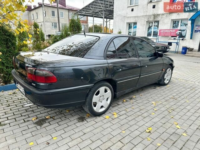 Черный Опель Омега, объемом двигателя 2.5 л и пробегом 320 тыс. км за 2600 $, фото 1 на Automoto.ua