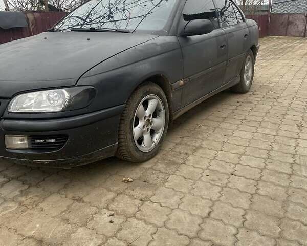 Чорний Опель Омега, об'ємом двигуна 2 л та пробігом 300 тис. км за 2100 $, фото 1 на Automoto.ua
