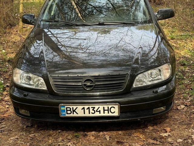 Черный Опель Омега, объемом двигателя 2.5 л и пробегом 275 тыс. км за 2600 $, фото 1 на Automoto.ua