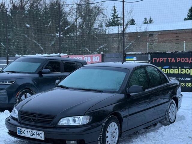 Черный Опель Омега, объемом двигателя 2.5 л и пробегом 270 тыс. км за 3199 $, фото 1 на Automoto.ua