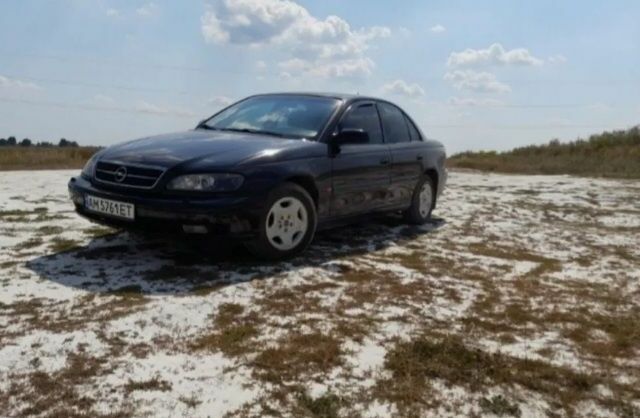 Черный Опель Омега, объемом двигателя 2.2 л и пробегом 600 тыс. км за 1900 $, фото 1 на Automoto.ua