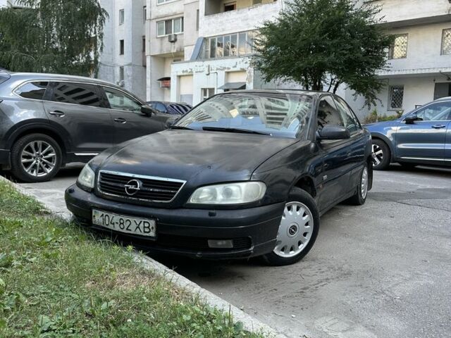 Черный Опель Омега, объемом двигателя 2.5 л и пробегом 333 тыс. км за 1355 $, фото 1 на Automoto.ua