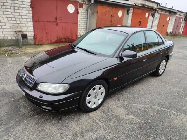 Черный Опель Омега, объемом двигателя 2.2 л и пробегом 249 тыс. км за 3350 $, фото 1 на Automoto.ua