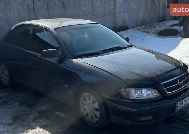 Черный Опель Омега, объемом двигателя 2.2 л и пробегом 263 тыс. км за 2000 $, фото 1 на Automoto.ua