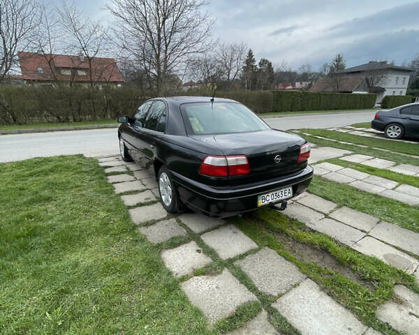 Чорний Опель Омега, об'ємом двигуна 2.2 л та пробігом 250 тис. км за 3900 $, фото 1 на Automoto.ua