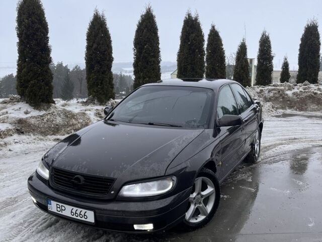 Черный Опель Омега, объемом двигателя 2.5 л и пробегом 293 тыс. км за 3000 $, фото 1 на Automoto.ua