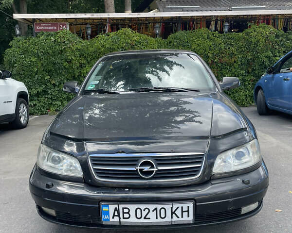 Черный Опель Омега, объемом двигателя 2.2 л и пробегом 262 тыс. км за 3300 $, фото 1 на Automoto.ua