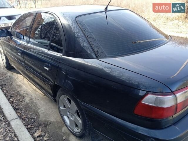 Черный Опель Омега, объемом двигателя 2.5 л и пробегом 300 тыс. км за 3400 $, фото 1 на Automoto.ua