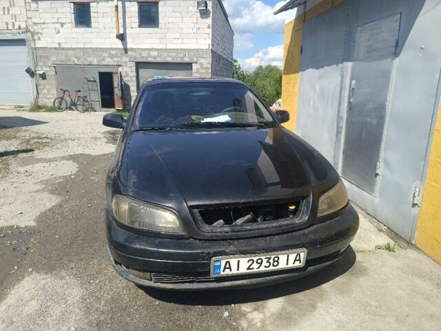 Черный Опель Омега, объемом двигателя 2.2 л и пробегом 300 тыс. км за 1200 $, фото 1 на Automoto.ua