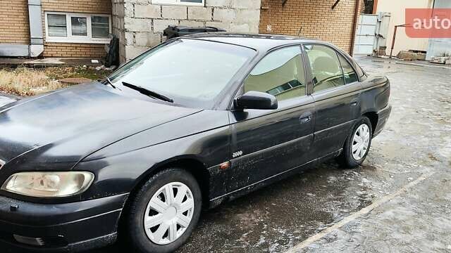 Черный Опель Омега, объемом двигателя 2.5 л и пробегом 325 тыс. км за 2500 $, фото 1 на Automoto.ua