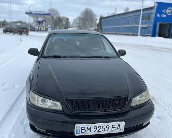Чорний Опель Омега, об'ємом двигуна 2.6 л та пробігом 250 тис. км за 2300 $, фото 1 на Automoto.ua