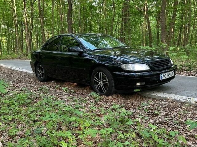 Черный Опель Омега, объемом двигателя 2.2 л и пробегом 461 тыс. км за 3300 $, фото 1 на Automoto.ua