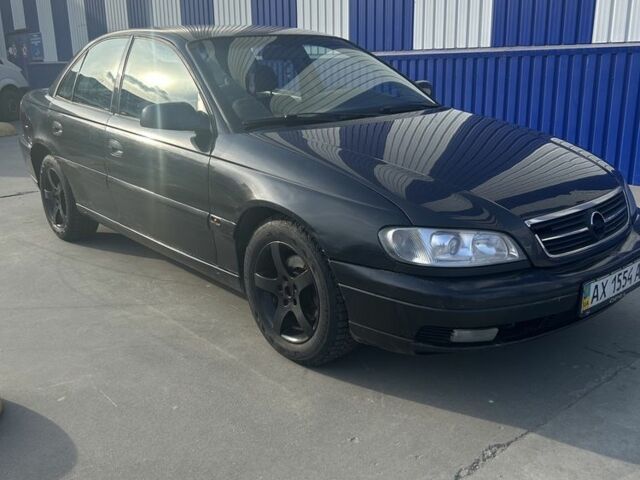 Черный Опель Омега, объемом двигателя 2.2 л и пробегом 320 тыс. км за 1899 $, фото 1 на Automoto.ua