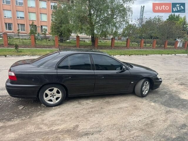 Черный Опель Омега, объемом двигателя 2.5 л и пробегом 390 тыс. км за 3250 $, фото 1 на Automoto.ua