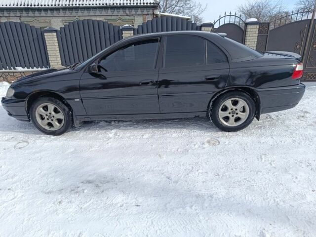 Черный Опель Омега, объемом двигателя 2 л и пробегом 300 тыс. км за 3600 $, фото 1 на Automoto.ua