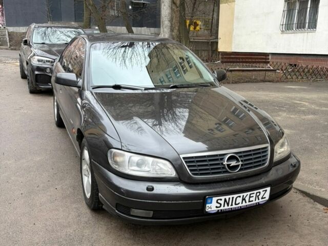 Черный Опель Омега, объемом двигателя 2.6 л и пробегом 409 тыс. км за 2700 $, фото 1 на Automoto.ua