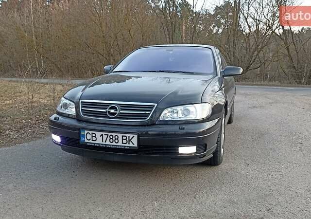 Черный Опель Омега, объемом двигателя 2.5 л и пробегом 295 тыс. км за 4400 $, фото 1 на Automoto.ua