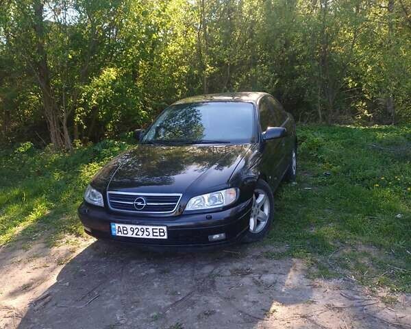 Черный Опель Омега, объемом двигателя 2.2 л и пробегом 330 тыс. км за 2450 $, фото 1 на Automoto.ua