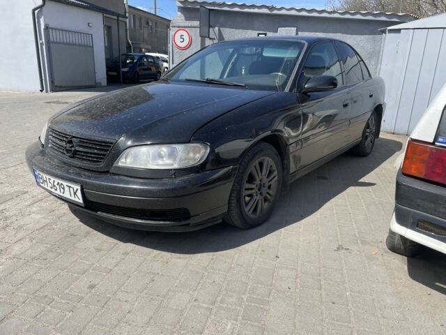 Черный Опель Омега, объемом двигателя 2.2 л и пробегом 535 тыс. км за 2200 $, фото 1 на Automoto.ua