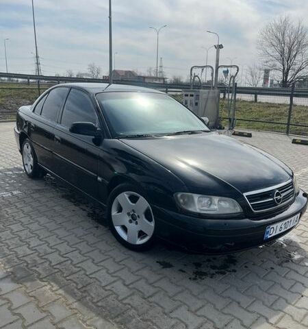 Черный Опель Омега, объемом двигателя 2.6 л и пробегом 300 тыс. км за 2500 $, фото 1 на Automoto.ua