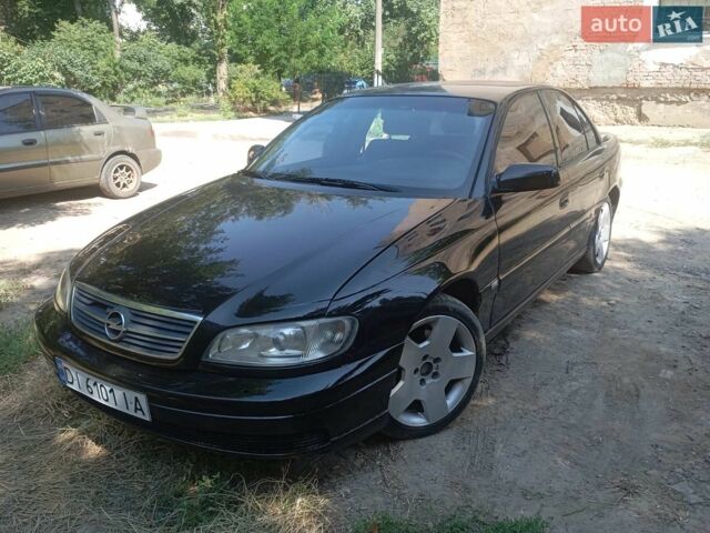 Черный Опель Омега, объемом двигателя 2.6 л и пробегом 310 тыс. км за 2200 $, фото 1 на Automoto.ua