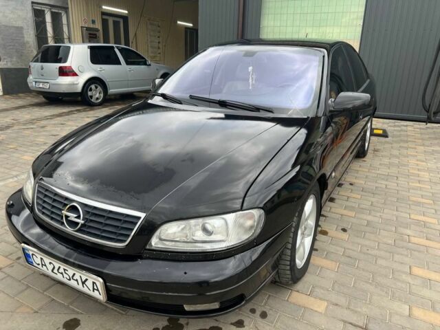 Черный Опель Омега, объемом двигателя 2.5 л и пробегом 270 тыс. км за 4300 $, фото 1 на Automoto.ua