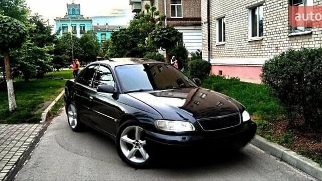 Черный Опель Омега, объемом двигателя 3.2 л и пробегом 555 тыс. км за 1999 $, фото 1 на Automoto.ua