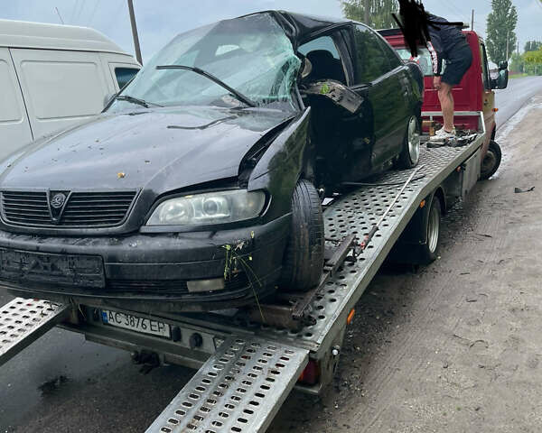 Черный Опель Омега, объемом двигателя 2.2 л и пробегом 474 тыс. км за 750 $, фото 1 на Automoto.ua