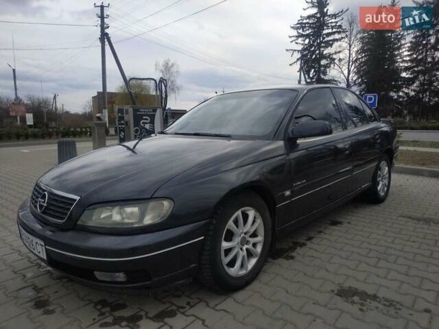 Черный Опель Омега, объемом двигателя 2.6 л и пробегом 300 тыс. км за 3100 $, фото 1 на Automoto.ua