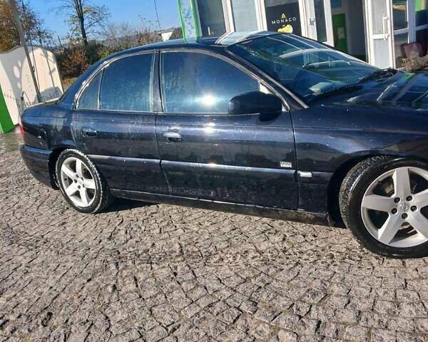 Черный Опель Омега, объемом двигателя 2.5 л и пробегом 215 тыс. км за 3000 $, фото 1 на Automoto.ua