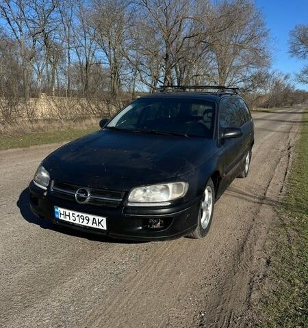 Черный Опель Омега, объемом двигателя 2 л и пробегом 344 тыс. км за 1999 $, фото 1 на Automoto.ua