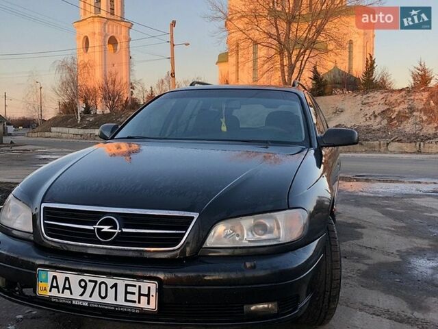 Черный Опель Омега, объемом двигателя 2.2 л и пробегом 350 тыс. км за 3500 $, фото 1 на Automoto.ua