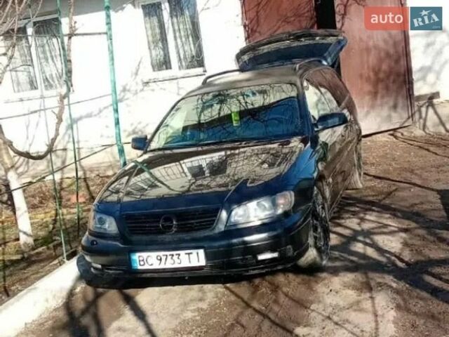 Черный Опель Омега, объемом двигателя 2.2 л и пробегом 335 тыс. км за 1800 $, фото 1 на Automoto.ua
