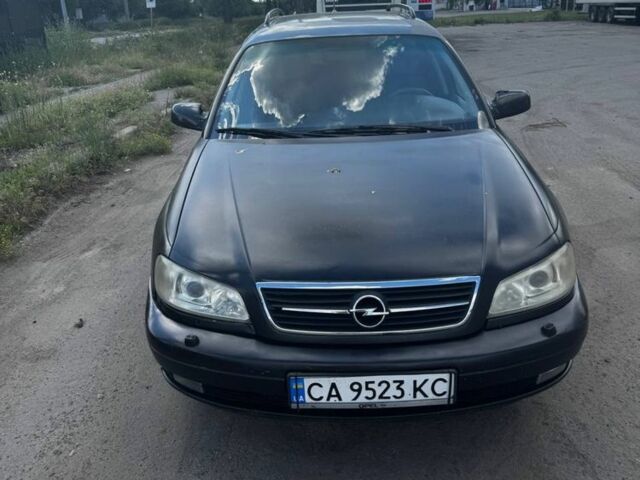 Черный Опель Омега, объемом двигателя 2.2 л и пробегом 370 тыс. км за 2500 $, фото 1 на Automoto.ua